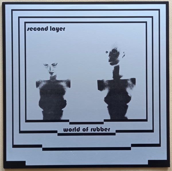 197212.jpg SECOND LAYER - World Of Rubber - Image 1